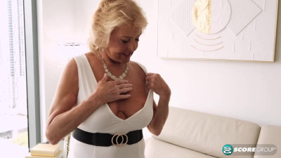 Busty granny Desiree Eden in white dress plays with her own pussy