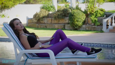 Sexy Lauren Louise in purple stockings and black Nikes by the pool