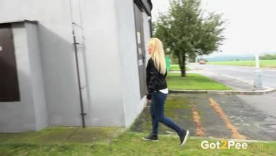 Blonde white young chick releases urine outside