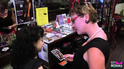 Lesbians kissing in a store