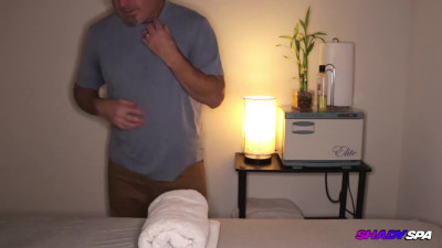 A gorgeous brunette sucks off a massage client