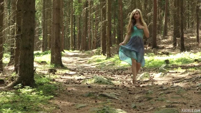 Horny blonde babe Sharon gives her pussy a nice fingering in the woods