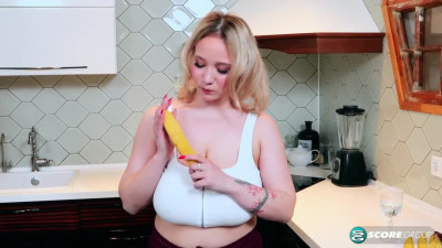 Busty blonde housewife Katie Rose flashes her amazing curves in the kitchen