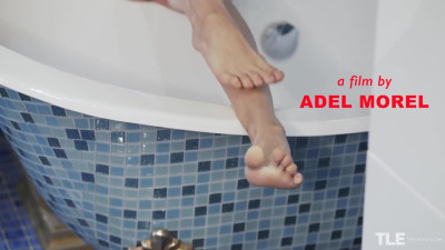 Dark haired Adel Morel gives her feet some care and attention